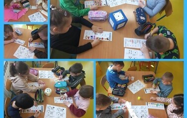 Dzieci utrwalały samogłoski w grze losowej z wykorzystaniem kostki do gry (sesja zimowa)