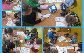 Dzieci utrwalały samogłoski w grze losowej z wykorzystaniem kostki do gry (sesja zimowa)